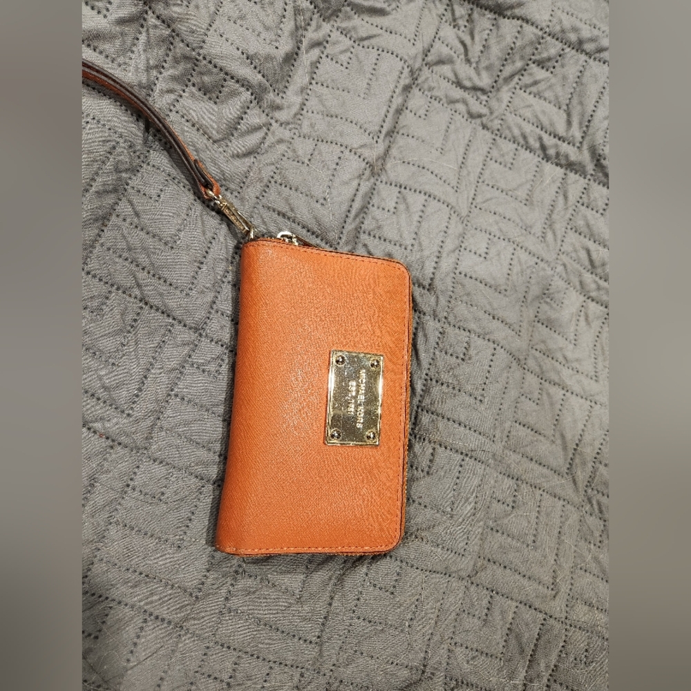 Orange Michael Kors wristlet
